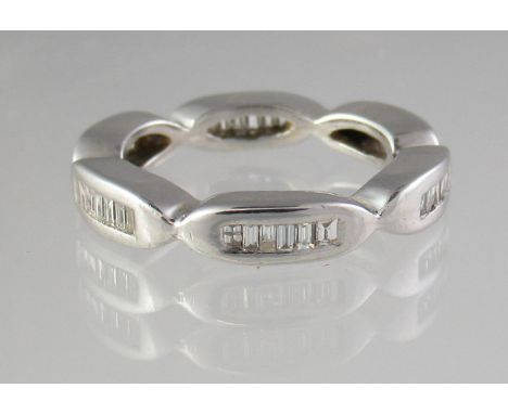 18ct white gold and diamond full eternity ring set with baguette cut stones.  Ring size J.  Approx weight 5.7 grams.(B.P. 21%