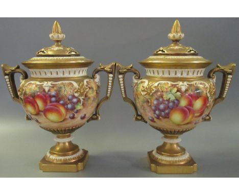 A pair of 1970's Royal Worcester pot pourri vases and covers, hand painted with plums, grapes, cherries, peaches and apples, 