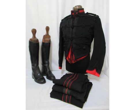 19th Century black military uniform having short jacket with braid decoration, red braided under jacket, cumberbund and three