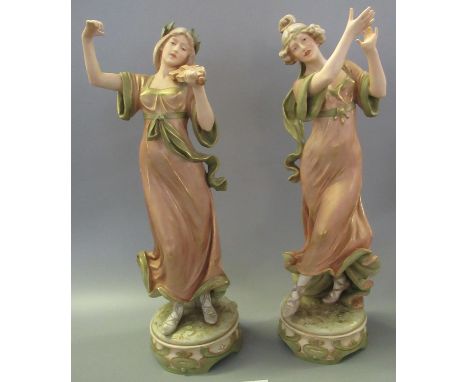 Pair of Art Nouveau Royal Dux porcelain figurines depicting female musical dancers, one with violin, impressed marks to both,