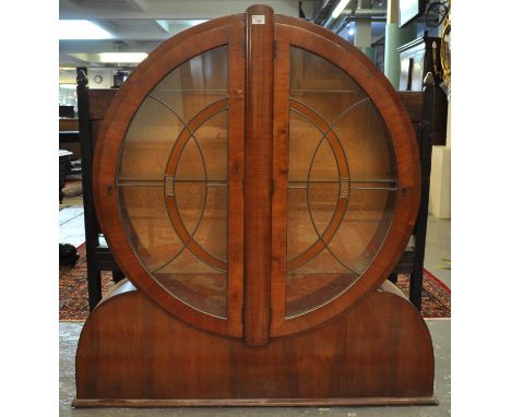 Art Deco veneered walnut bullseye cabinet with stained glass leaded doors. 124 x 130cm approx (W x H) (B.P. 21% + VAT)Minor l