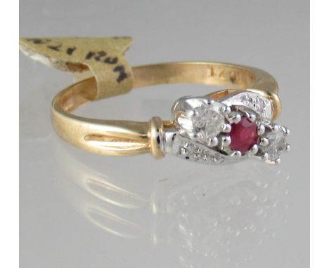 9ct gold ruby and diamond three stone ring.  Ring size P.  Approx weight 2.8 grams.(B.P. 21% + VAT) 