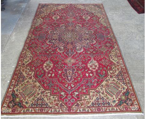 Vintage style Morty multi-coloured ground Persian Tabrez carpet with central medallions of flowers and foliage flanked by pet