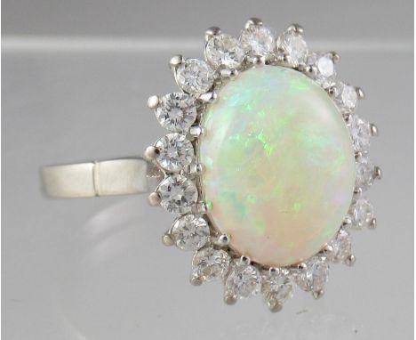 18ct white gold opal and diamond ring.  Ring size P&1/2.  Approx weight 6.3 grams.(B.P. 21% + VAT) 