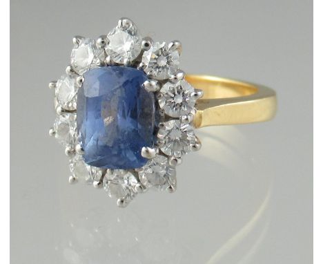 18ct gold sapphire and diamond cluster ring. Ring size M&amp;1/2. Approx weight 6.6 grams. (B.P. 21% + VAT)