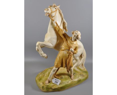 Royal Dux Art Nouveau porcelain figure group of a rearing horse with young girl on naturalistic base, impressed marks and pin