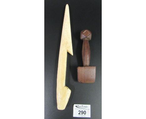 Probably 19th Century whale bone carved sailors needle, together with a moulded wooden caulker or 'slicker'. (2) (B.P. 21% + 