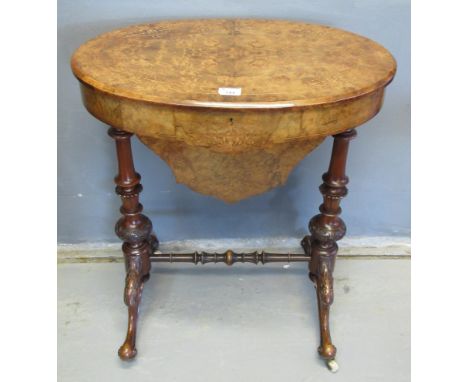 Victorian inlaid burr walnut ladies work box/sewing table of oval form, standing on turned supports and central stretcher wit