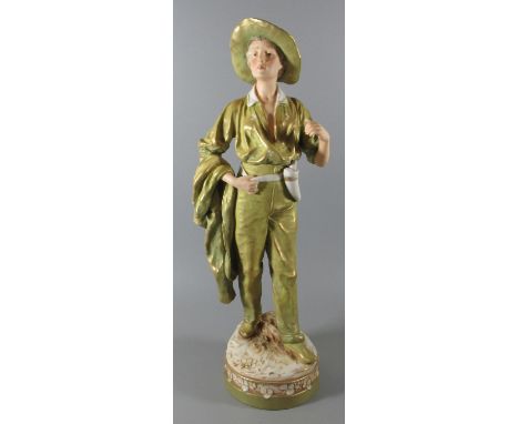 Royal Dux Art Nouveau porcelain figure modelled by F. Otto of a young man in green trousers with coat slung over his shoulder