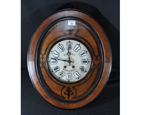 Late 19th/early 20th Century French 8 day oval shaped 'vineyard' wall clock, the walnut case with ebonised and inlaid decorat