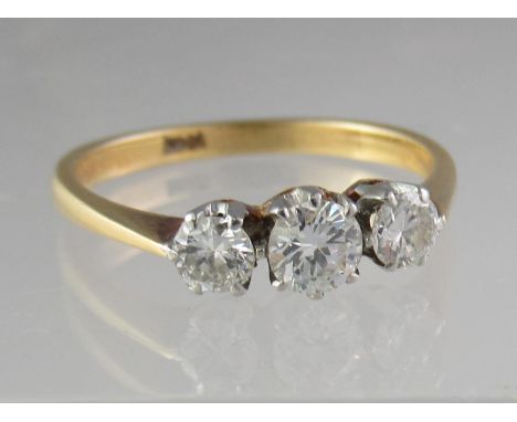 Three stone diamond ring set in 18ct gold.  Ring size P & 1/2.  Approx weight 3 grams.(B.P. 21% + VAT) 