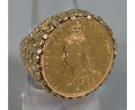 Victorian gold sovereign 1889 set in fancy pierced scrollwork 9ct gold ring shank. 16g approx. (B.P. 21% + VAT)Ring size M.