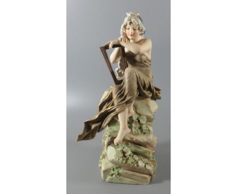 Royal Dux Art Nouveau porcelain figure of 'Loreley' modelled with a harp on a rocky outcrop. 31cm high approx. (B.P. 21% + VA