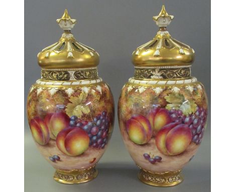 Pair of Royal Worcester 1970's porcelain crown top pot-pourri jars and reticulated covers with inner lids, hand painted and s