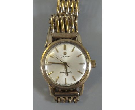 Omega 9ct gold 'Ladymatic' automatic ladies wristwatch with 9ct gold gate bracelet strap, the face with baton numerals and sw