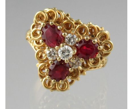 18ct gold ruby and diamond cluster ring.  Ring size M.  Approx weight 6.4 grams.(B.P. 21% + VAT) 