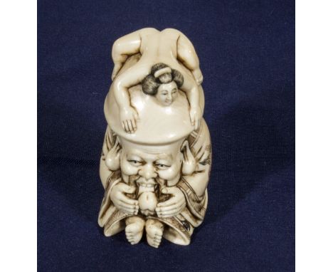 A Japanese carved ivory erotic netsuke