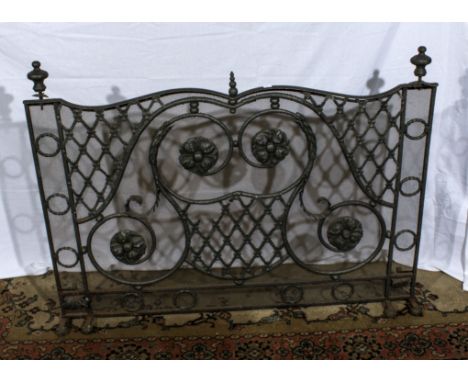 A wrought iron fireguard