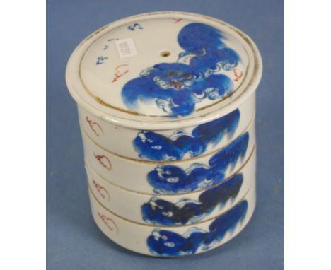 Chinese blue & white ceramic food jar decorated with figures, and Chinese script. Four circular sections. Height 12cms approx