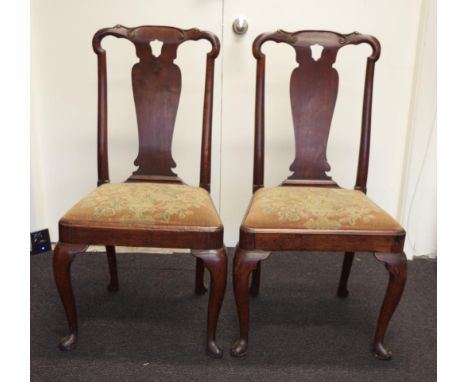 Pair of Queen Anne walnut chairs circa 1714, with fiddle shaped splats and 'C' scroll ears to crest rails supported by cabrio
