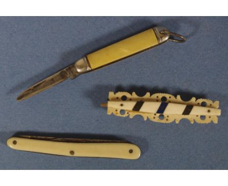 Two vintage pen knives together with a vintage toothpick holder