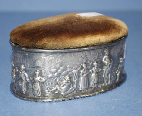 Antique silver plated sewing trinket box base with embossed figures. Lid of padded velvet. Length 10cms approx.