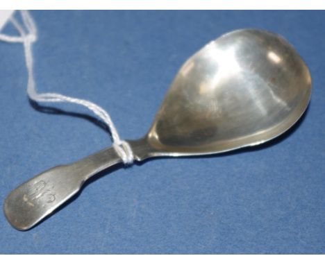 George IV sterling silver caddy spoon possibly Birmingham 1826, makers marks rubbed. Monogrammed. Weight 10grams approx.