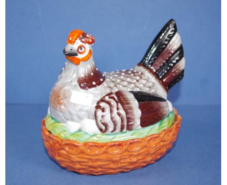 Vintage Staffordshire chicken topped dish figure of hatching chicken to lid, orange basketweave base. Length 14.5cms approx H
