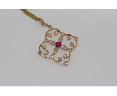 10ct gold, ruby & diamond pendant weight: approx 2.86 grams on a rolled gold chain, size: approx 4cm including bale