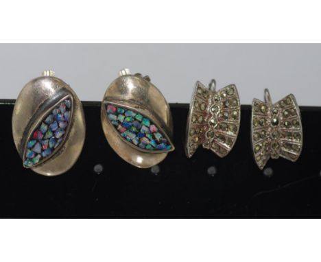 Scanda silver clip earrings set with opal together with another screw on marcasite set