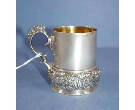Vintage Tiffany sterling silver christening mug embossed decoration to handle and base. Gilt washed interior. Marked to base 