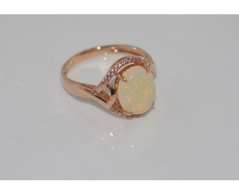 14ct rose gold and opal ring weight: approx 3.06 grams, size: N/6-7