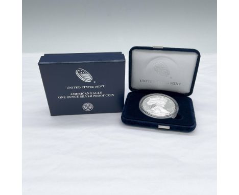 1 ounce West Point Mint in US Mint Packaging. The obverse side depicts Liberty in full stride, wrapped in folds of the flag a