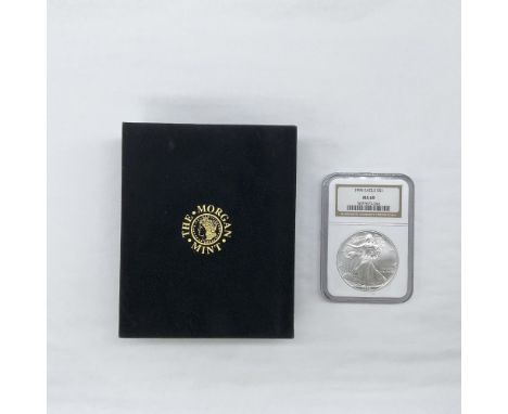 The obverse side depicts Liberty in full stride, wrapped in folds of the flag and cradling branches of laurel and oak. The re