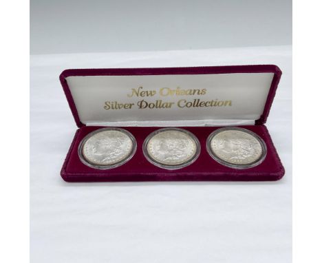 New Orleans Mint. The obverse design depicts the profile of Liberty in a cap with a small floral crown. The reverse design is