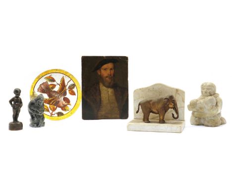 Two inuit carvings of crouching figures, the largest; 11cm high, together with a miniature portrait of a bearded gentleman, 1