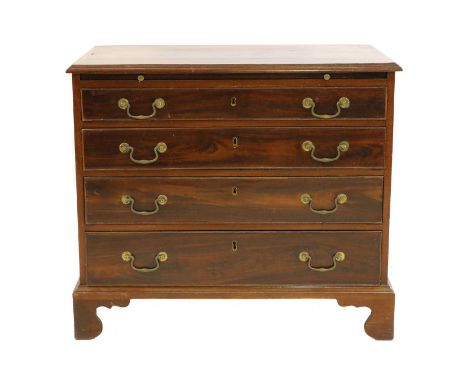 A George III mahogany bachelor's chest, the crossbanded top over brushing slide and four graduated drawers each with a brass 