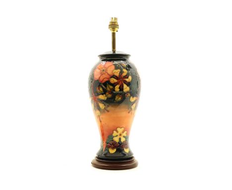 A Moorcroft Oberon pomegranate pattern table lamp. 35cm high including wooden base but not brass fittingCondition report: Goo