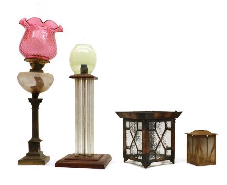 A Duplex brass and cranberry glass oil lamp, the flared shade on a Corinthian column base, 71cm high, a teak table lamp unite