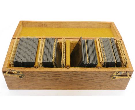 A collection of various magic lantern slides, to include an unusual slide of a Victorian gentleman seated beside two skeleton