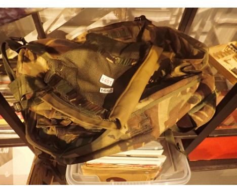 Army camouflage rucksack and a combat jerkin