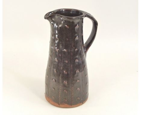 JIM MALONE. A tall Jim Malone pitcher with applied decoration. Impressed personal &amp; 'A' marks. Small chip to handle. Heig