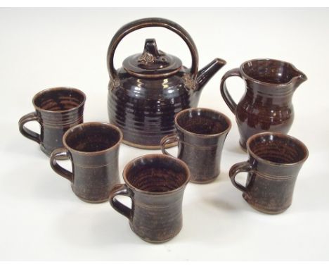 JOHN DAVIDSON. A teapot, jug &amp; five mugs made at the Truro Pottery, Cornwall by John Davidson. Personal marks on teapot &