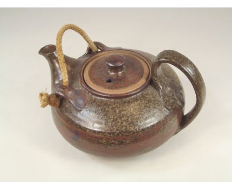 MICK MORGAN. A Mick Morgan teapot with rope front handle. Width 23cm. Impressed mark.