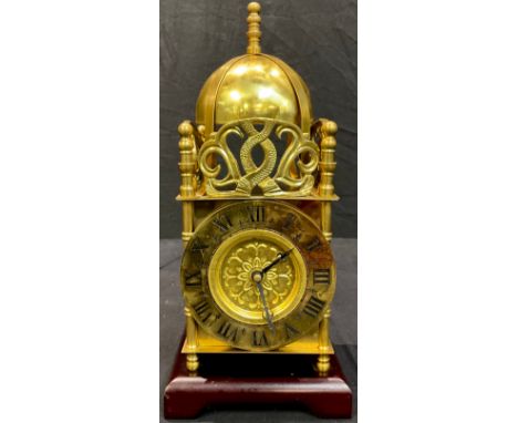 A reproduction 19th century style brass lantern clock, wooden base, 32cm high overall 