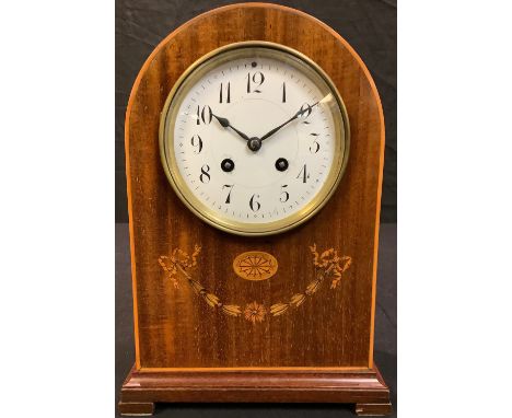 An Edwardian mahogany inlaid domed mantel clock, white enamel dial, Arabic numerals, twin winding holes, striking on a bell, 