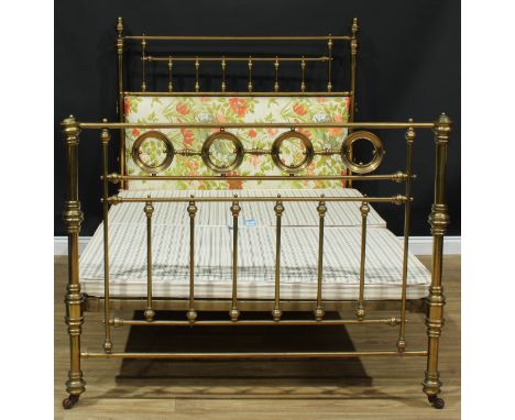 A brass bed, the headboard 147cm high, the base 192cm x 139cm 