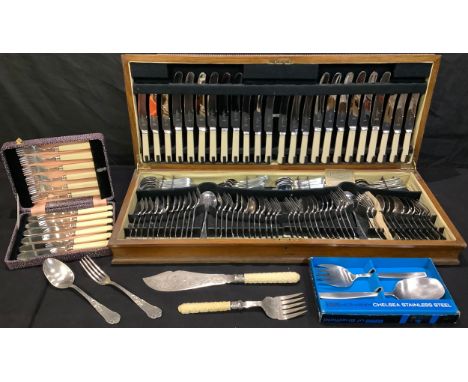 An oak canteen containing a comprehensive set of stainless steel flatware, 74cm wide; a pair of 19th century silver plated fi