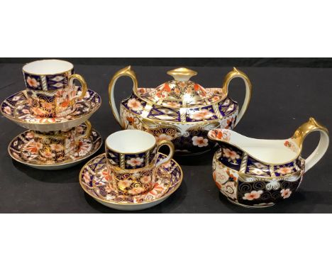 A Royal Crown Derby 2451 pattern oval sucrier and cover, cream jug, three coffee cans and saucers, printed marks, early 20th 