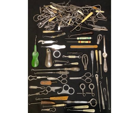 A collection of button hooks including silver hafted, advertising, novelty, etc; other advertising including shoe horns, scis